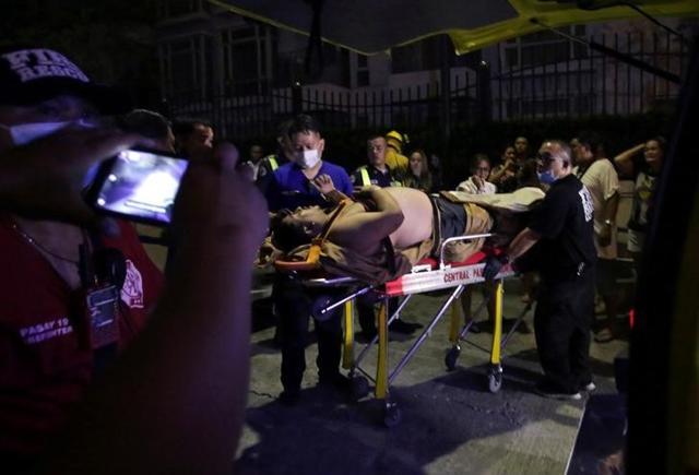An injured hotel guest is seen outside of a hotel after a shooting incident inside Resorts World Manila in Pasay City, Metro Manila, Philippines. (Reuters) An injured hotel guest is seen outside of a hotel after a shooting incident inside Resorts World Manila in Pasay City, Metro Manila, Philippines. (Reuters)