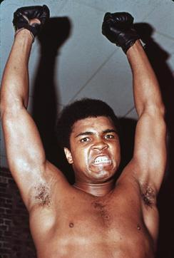 Portrait of American boxer Cassius Clay (who changed his name to Muhammad Ali in 1964) as he raises his fists above his head and growls fiercely, early 1960s. (Hulton Archive/Getty Images) Portrait of American boxer Cassius Clay (who changed his name to Muhammad Ali in 1964) as he raises his fists above his head and growls fiercely, early 1960s. (Hulton Archive/Getty Images)