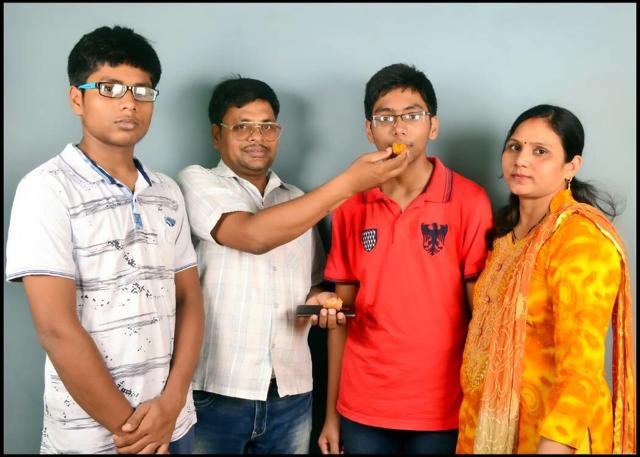 Avijit Srivastava (second from left) with his parents. (Sourced) Avijit Srivastava (second from left) with his parents. (Sourced)