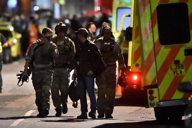 Armed officers attend to an incident near London Bridge. (Reuters) Armed officers attend to an incident near London Bridge. (Reuters)
