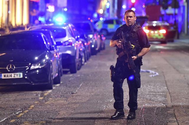 An armed police stands on Borough High Street as authorities deal with an incident on London Bridge. (AP Photo) An armed police stands on Borough High Street as authorities deal with an incident on London Bridge. (AP Photo)
