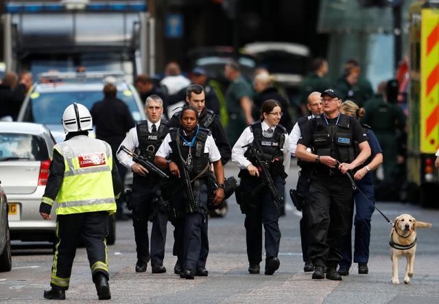 Armed police officers walk outside Borough Market after an attack left six people dead and dozens injured in London, Britain. (Reuters) Armed police officers walk outside Borough Market after an attack left six people dead and dozens injured in London, Britain. (Reuters)