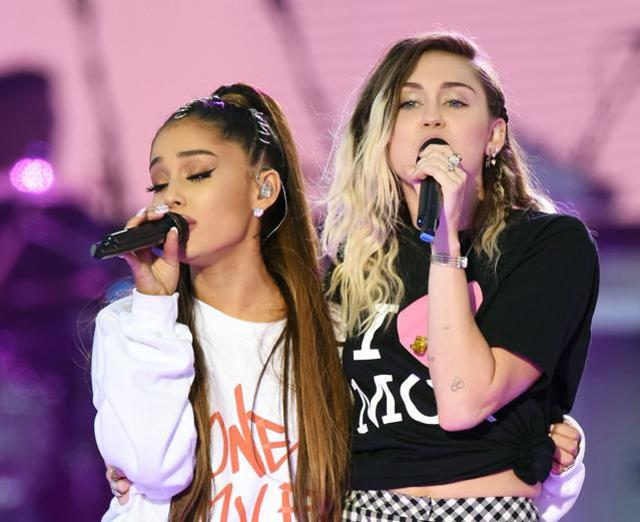Ariana Grande, left, and Miley Cyrus perform at the One Love Manchester tribute concert in Manchester. (AP) Ariana Grande, left, and Miley Cyrus perform at the One Love Manchester tribute concert in Manchester. (AP)