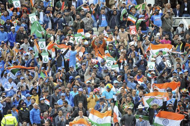 Cricket fans cheer for their teams during the ICC Champions Trophy match between India and Pakistan. (AP)