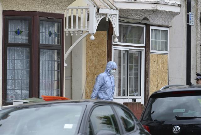 A forensic officer walks from at a house in east London, after police conducted raids following Saturday's deadly terror attack in the capital. (AP Photo) A forensic officer walks from at a house in east London, after police conducted raids following Saturday's deadly terror attack in the capital. (AP Photo)