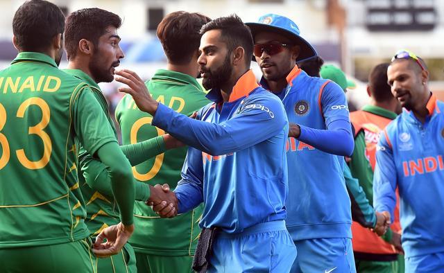 India's captain Virat Kohli (C) shakes hands with Pakistan players after the ICC Champions trophy match. (AFP)