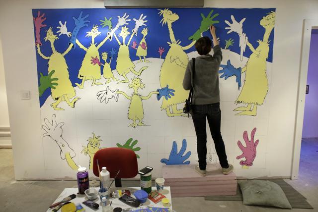 Cortney Thibodeau, a senior at University of Massachusetts at Amherst, paints a mural based on artwork from the Dr. Seuss book "Oh, The Things You Can Think!" at The Amazing World of Dr. Seuss Museum. (AP) Cortney Thibodeau, a senior at University of Massachusetts at Amherst, paints a mural based on artwork from the Dr. Seuss book "Oh, The Things You Can Think!" at The Amazing World of Dr. Seuss Museum. (AP)
