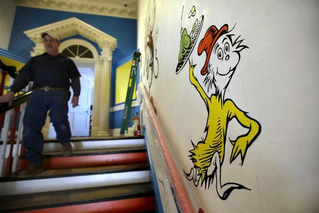 A man walks past a mural with the character "Sam-I-Am" from the Dr. Seuss book Green Eggs and Ham. (AP) A man walks past a mural with the character "Sam-I-Am" from the Dr. Seuss book Green Eggs and Ham. (AP)