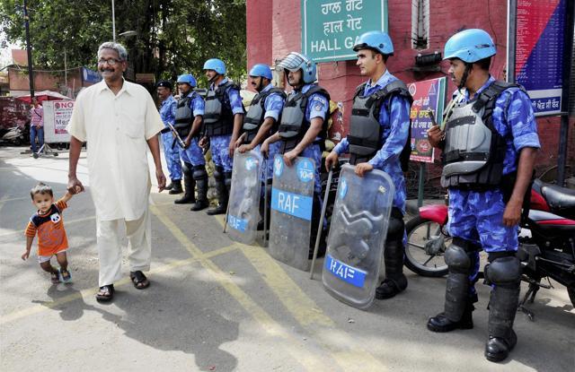 Rapid Action Force personnel stand guard on the eve of Operation Bluestar anniversary in Amritsar on Monday. (PTI Photo) Rapid Action Force personnel stand guard on the eve of Operation Bluestar anniversary in Amritsar on Monday. (PTI Photo)