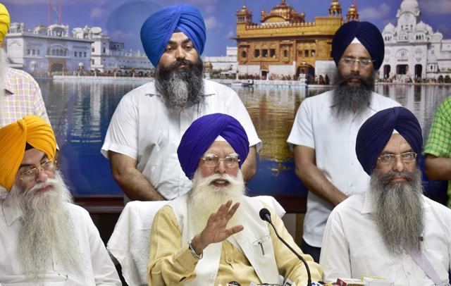 SGPC president Kirpal Singh Badungar, flanked by other members, addressing the media in the Golden Temple complex in Amritsar on Monday. (Gurpreet Singh/HT)