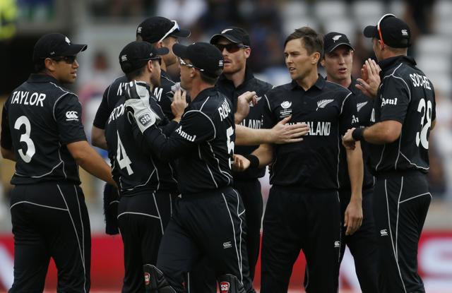 New Zealand’s Trent Boult celebrates taking the wicket of Australia’s David Warner with team mates. (REUTERS) New Zealand’s Trent Boult celebrates taking the wicket of Australia’s David Warner with team mates. (REUTERS)