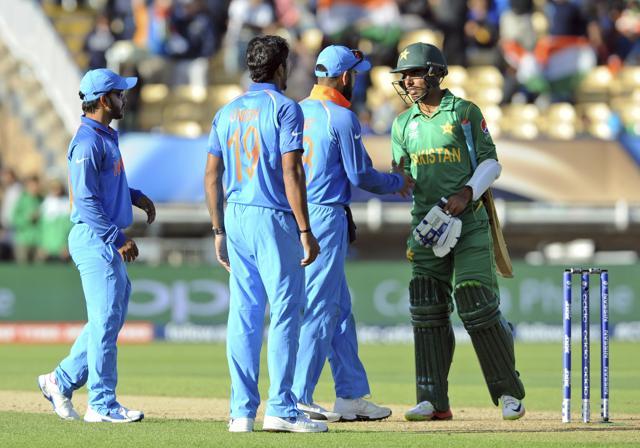 Indian cricket captain Virat Kohli shakes hand with Pakistan's Shadab Khan at the end of the ICC Champions Trophy match between India and Pakistan at Edgbaston in Birmingham on June 4, 2017. (AP)