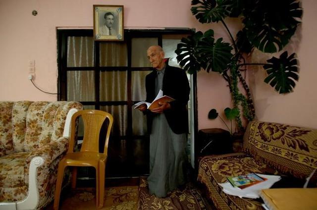 Abu Ajameyah gave up school to work selling food, and only started thinking about studying again once he retired decades later. (Reuters Photo)