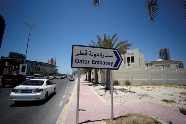 A sign indicating a route to Qatar embassy is seen in Manama, Bahrain. (Reuters Photo) A sign indicating a route to Qatar embassy is seen in Manama, Bahrain. (Reuters Photo)