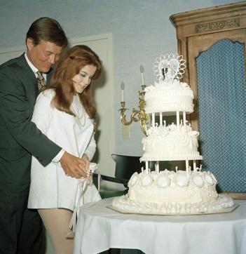 FILE - In this May 8, 1967 file photo, actors Ann-Margret and Roger Smith cutting the cake on their wedding day in Las Vegas. (AP)