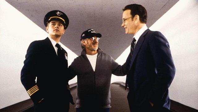 Steven Spielberg (C) directs Leonardo DiCaprio (L) and Tom Hanks (R) on the set of Catch Me If You Can.