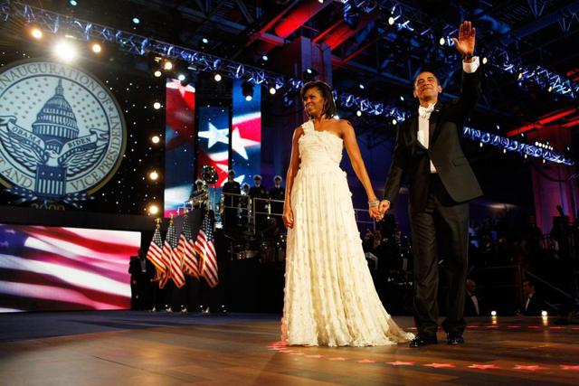 The First Lady in a one-shouldered white gown by designer Jason Wu.