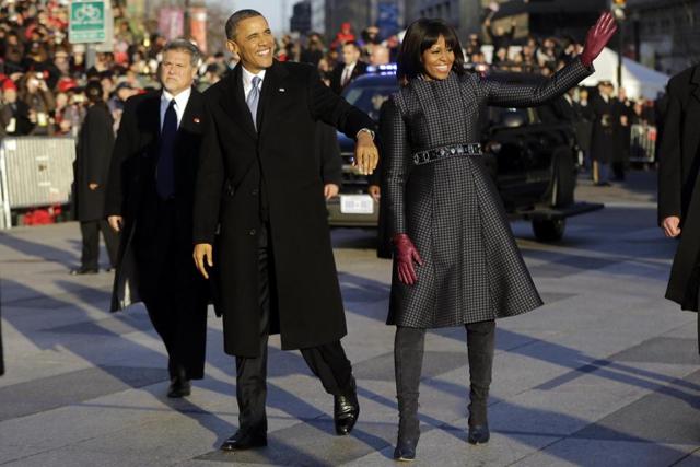 Michelle Obama in a coat and dress by American designer Thom Browne.