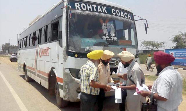 The VB team checking documents of a private bus at Batala bypass on Friday. (HT Photo) The VB team checking documents of a private bus at Batala bypass on Friday. (HT Photo)