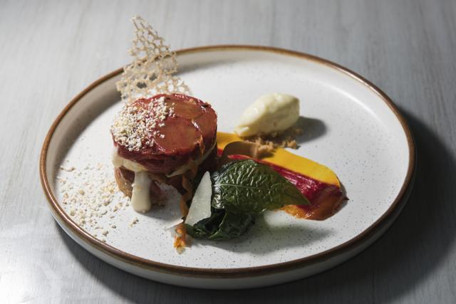 A standout dish at Slink &amp; Bardot is the tomato and mozzarella tart. Sweet, skinned tomatoes and gooey mozzarella come stacked on a thin, crushed-Parmesan, biscuit-like base. (Aalok Soni / HT Photos)