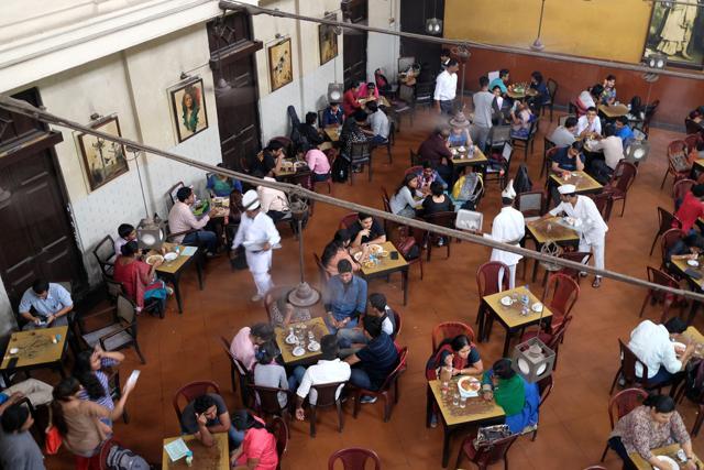 Visitors of the popular Indian Coffee House. The India Coffee House chain was started by the Coffee Cess Committee in 1936 in Bombay. (Shutterstock) Visitors of the popular Indian Coffee House. The India Coffee House chain was started by the Coffee Cess Committee in 1936 in Bombay. (Shutterstock)