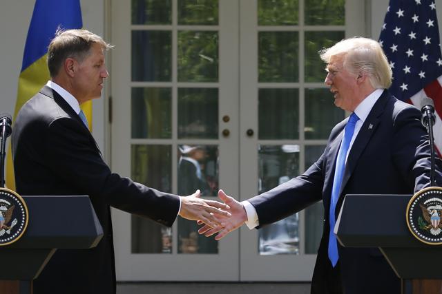Donald Trump shakes hands with his Romanian counterpart Klaus Iohannis after a joint news conference in the Rose Garden on Friday. (Reuters) Donald Trump shakes hands with his Romanian counterpart Klaus Iohannis after a joint news conference in the Rose Garden on Friday. (Reuters)