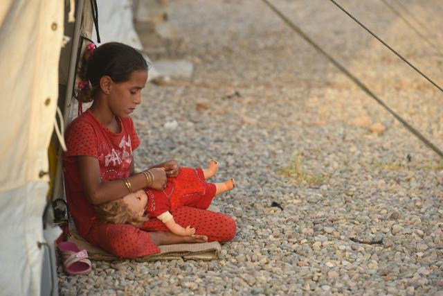 A displaced Iraqi child sits at the Hasan Sham camp for internally displaced people on June 10, 2017. (AFP) A displaced Iraqi child sits at the Hasan Sham camp for internally displaced people on June 10, 2017. (AFP)