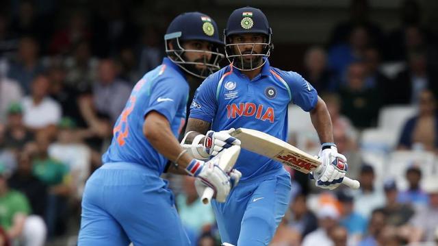 Shikhar Dhawan (R) and India captain Virat Kohli shared a 128-run stand for the second wicket. (AFP)