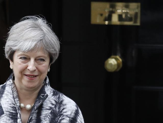 Theresa May leaves after a cabinet meeting at 10 Downing Street after the general election in London. (AP Photo)