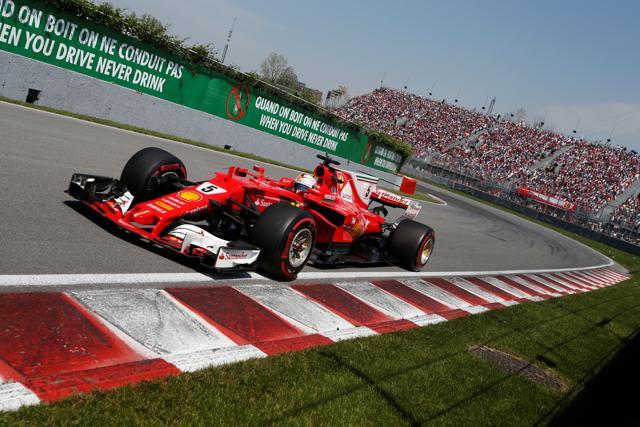 Sebastian Vettel suffered a damaged front wing at the start of the race but fought back to finish in fourth place. (REUTERS)