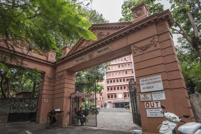 The main gate remains imposing. Beyond, the polytechnic institute and the Bhabha auditorium, a popular venue for plays. (Pratik Chorge/HT Photo )