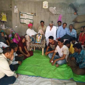 People waiting for chief minister at the house of Abhishekh Patodar who died in police firing. (HT Photo)
