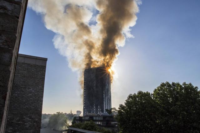 Smoke billows from a high-rise apartment building in west London Wednesday. (AP Photo) Smoke billows from a high-rise apartment building in west London Wednesday. (AP Photo)