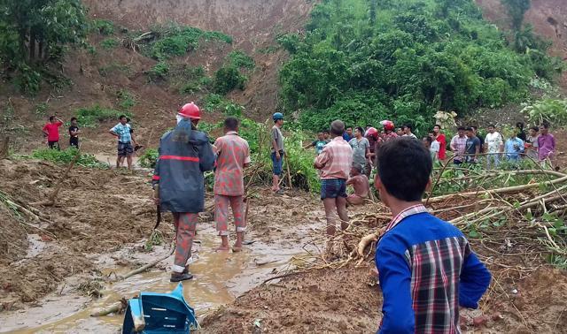 Bangladeshi firefighters search for bodies after a landslide in Rangamati on Tuesday, June 13. (AFP) Bangladeshi firefighters search for bodies after a landslide in Rangamati on Tuesday, June 13. (AFP)
