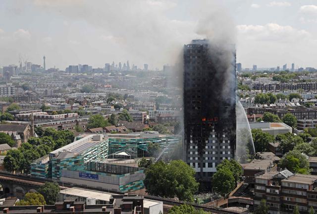 Smoke and flames billows from Grenfell Tower as firefighters attempt to control a blaze at a residential block of flats. (AFP Photo) Smoke and flames billows from Grenfell Tower as firefighters attempt to control a blaze at a residential block of flats. (AFP Photo)