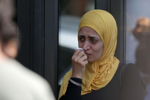 A woman reacts outside a temporary casualty bureau for people affected by the fire at Grenfell Tower. (AFP Photo) A woman reacts outside a temporary casualty bureau for people affected by the fire at Grenfell Tower. (AFP Photo)