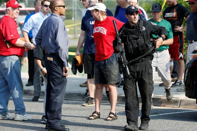 Police investigate the shooting scene after a gunman opened fire on Republican members of Congress during a baseball practice near Washington in Alexandria, Virginia. (REUTERS) Police investigate the shooting scene after a gunman opened fire on Republican members of Congress during a baseball practice near Washington in Alexandria, Virginia. (REUTERS)