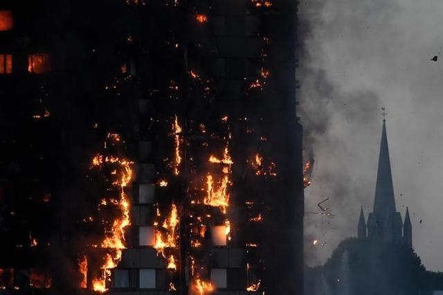 Flames and smoke billow as firefighters deal with a serious fire in a tower block at Latimer Road in West London, Britain June 14, 2017. (Reuters) Flames and smoke billow as firefighters deal with a serious fire in a tower block at Latimer Road in West London, Britain June 14, 2017. (Reuters)