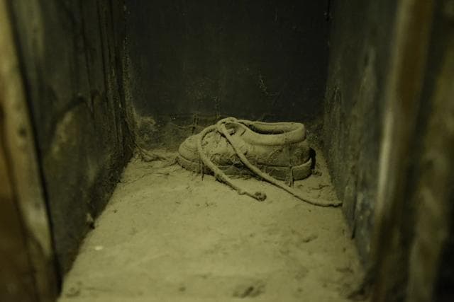 A dust-coated shoe inside the hall. In the ensuing legal battle, twelve accused people were convicted including theatre owners Sushil and Gopal Ansal. (Burhaan Kinu/HT PHOTO) A dust-coated shoe inside the hall. In the ensuing legal battle, twelve accused people were convicted including theatre owners Sushil and Gopal Ansal. (Burhaan Kinu/HT PHOTO)