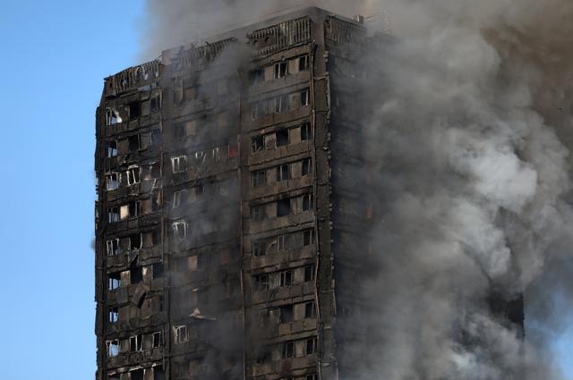 The burnt facade of the Grenfell Tower block is seen as firefighters tackle a serious fire at Latimer Road in West London. (Neil Hall/REUTERS) The burnt facade of the Grenfell Tower block is seen as firefighters tackle a serious fire at Latimer Road in West London. (Neil Hall/REUTERS)