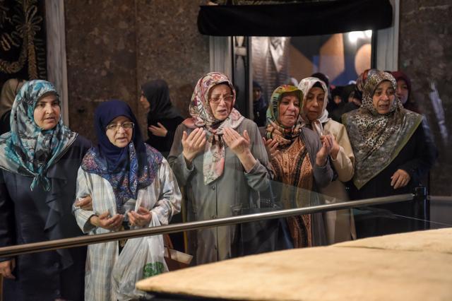 A group of women offers prayers beside what is believed to be the sacred cloak of the Prophet Mohammed in a mosque in Istanbul on June 2, 2017. (AFP) A group of women offers prayers beside what is believed to be the sacred cloak of the Prophet Mohammed in a mosque in Istanbul on June 2, 2017. (AFP)