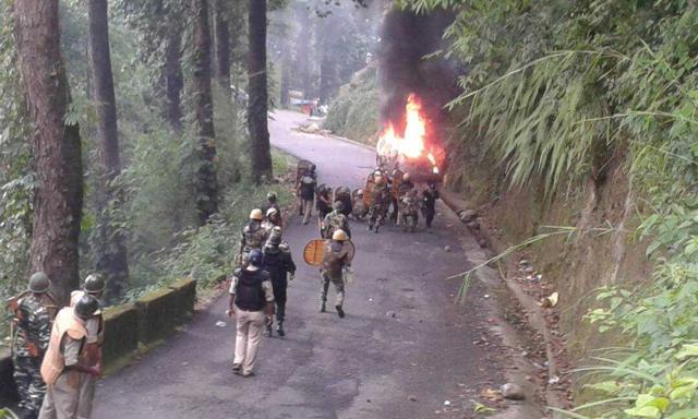 GJM supporters set fire to a vehicle near Patlabash. (Bikram Sashanker/HT Photo) GJM supporters set fire to a vehicle near Patlabash. (Bikram Sashanker/HT Photo)