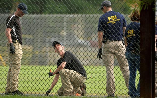 FBI technicians examine the outfield area of a baseball field for evidence where shots were fired during a Congressional baseball practice wounding House Majority Whip Steve Scalise (R-LA), in Alexandria, Virginia, U.S., June 14, 2017. (Reuters Photo)