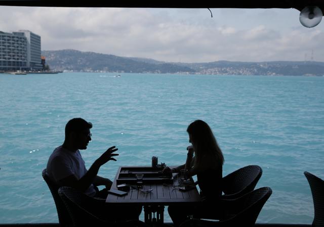 People play backgammon in a coffee shop by Istanbul's Bosphorus Strait on Wednesday. (AP) People play backgammon in a coffee shop by Istanbul's Bosphorus Strait on Wednesday. (AP)