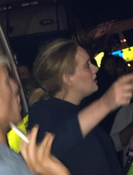 Adele is pictured near the Grenfell Tower apartment block at Latimer Road in West London, Britain on June 15, 2017, in this picture obtained from social media. (Twitter/Reuters)