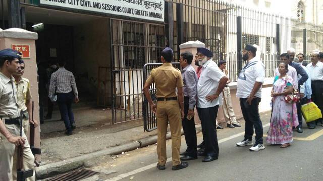 Police conducting checks before letting people into the court. (HT Photo)