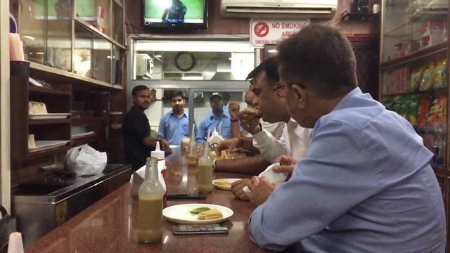 Customers enjoying their sandwiches. Customers enjoying their sandwiches.