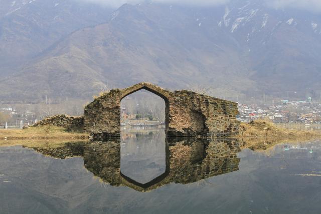 The old Mughal Bridge on the Dal Lake is the remnant of an ancient road from the Mughal empire. This bridge is only accessible by a shikara. (Shutterstock) The old Mughal Bridge on the Dal Lake is the remnant of an ancient road from the Mughal empire. This bridge is only accessible by a shikara. (Shutterstock)