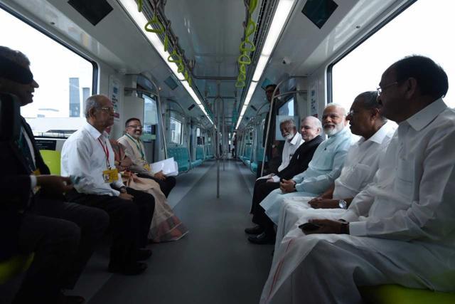 Prime Minister Narendra Modi on Saturday took a ride in the newly inaugurated Kochi Metro, Kerala’s first metro line, from the Southern Naval Command’s air terminal to the Palarivattom station. He is accompanied by Pinarayi Vijayan, Venkaiah Naidu (R), Governor P Sathasivam, BJP state chief Kummanam Rajasekharan. Delhi Metro Rail Corporation Principal Advisor E Sreedharan is also present. (PIB India) Prime Minister Narendra Modi on Saturday took a ride in the newly inaugurated Kochi Metro, Kerala’s first metro line, from the Southern Naval Command’s air terminal to the Palarivattom station. He is accompanied by Pinarayi Vijayan, Venkaiah Naidu (R), Governor P Sathasivam, BJP state chief Kummanam Rajasekharan. Delhi Metro Rail Corporation Principal Advisor E Sreedharan is also present. (PIB India)