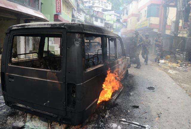 Soldiers patrol near a burning vehicle after clashes with supporters of the Gorkha Janmukti Morcha in Darjeeling on Saturday. (AFP) Soldiers patrol near a burning vehicle after clashes with supporters of the Gorkha Janmukti Morcha in Darjeeling on Saturday. (AFP)
